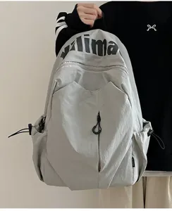 Detailed view of light grey casual backpack, waterproof design with spacious room.