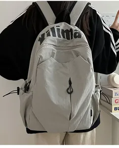 Casual lightweight waterproof backpack for students and travel, large capacity daypack