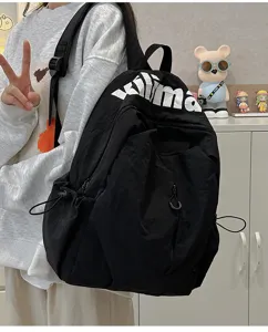 Black nylon lightweight casual backpack, large capacity high school student travel rucksack.