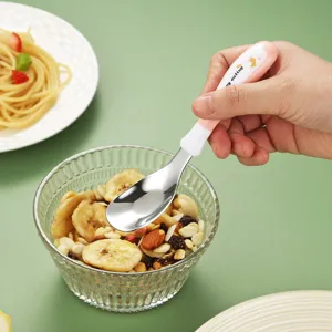 Toddler stainless steel training spoon with ergonomic handle for baby feeding main view.