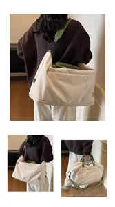 Large capacity travel duffel bag, casual canvas weekender bag with green straps for women and men.