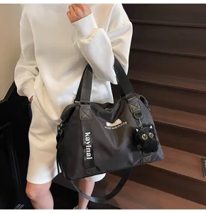Sac de voyage noir pour femme, grand sac de sport fitness, sac bandouliere de loisir quotidien.