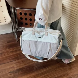 Large capacity travel duffel bag for women and men, lightweight weekend overnight bag.