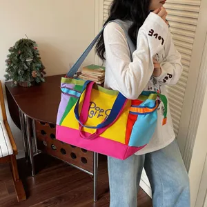 Detailed view of the colorful canvas tote bag, featuring a stylish color-block design.