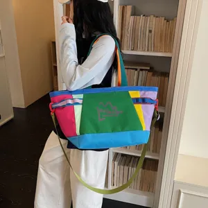Large capacity color block canvas tote bag for travel, lightweight and stylish shoulder bag.