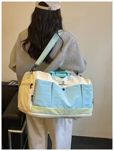 Detailed view of the multi-pocket canvas travel duffel bag in stylish color block.