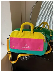 Color-blocked travel duffel bag for women, large capacity bag for fitness and trips.