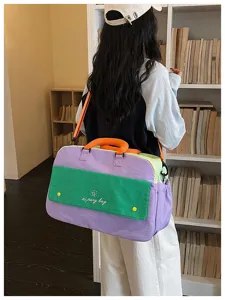 Color-block travel duffel bag for women, large capacity lightweight gym and sports workout bag.