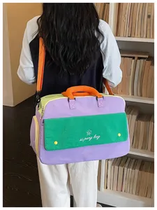 Colorful colorblock travel bag for women, large capacity shoulder luggage and gym bag.