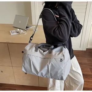 Grand sac de voyage imperméable, sac de sport étanche avec bandoulière ajustable.