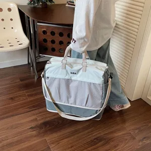 Large capacity travel bag for women and men, lightweight weekend duffel bag with shoulder strap.