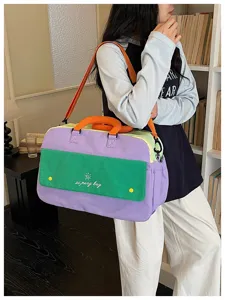 Colorful color-block travel duffel bag for women, large capacity casual shoulder bag.