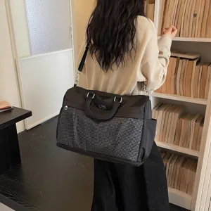 Large capacity travel duffel bag for women, lightweight waterproof weekender bag for short trips.