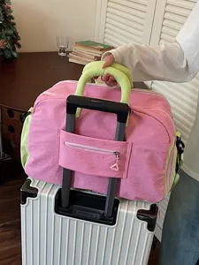 Dopamine color-block travel bag for women, large capacity lightweight gym and luggage duffel.