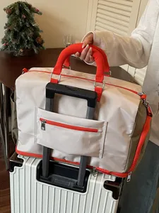 Large capacity travel duffel bag for women, lightweight short trip luggage bag with trolley sleeve.