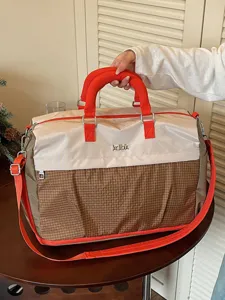 Large capacity travel duffel bag for women and men, lightweight gym sports and flight carry on.