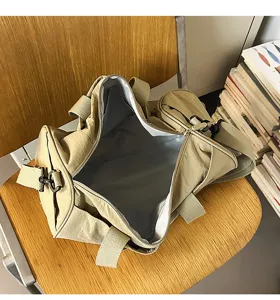 Detail view of khaki sports duffel bag interior compartment, showing spacious storage design.