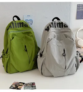 Casual large capacity backpack for students, lightweight waterproof nylon school bag for travel.