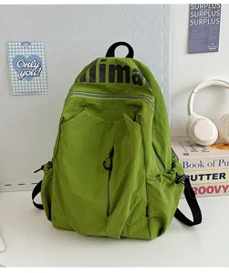 Green casual lightweight backpack detail, water-resistant daypack for outdoor student travel.