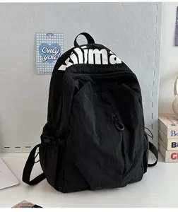 Casual black backpack with large capacity, lightweight and water-repellent design for daily use.