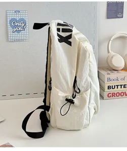 White canvas casual backpack detail view, large capacity, lightweight and durable fabric.