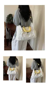 Gran bolsa de viaje de lona con asas amarillas, multi-bolsillos, ligera y práctica.
