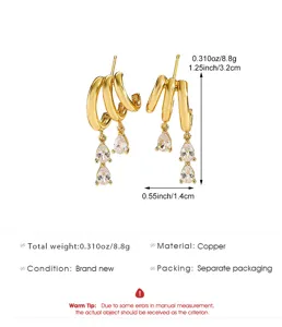 Gold triple hoop earrings with teardrop cubic zirconia drops measuring 1.25 inches long