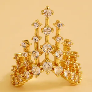 Detailed macro view of golden castle crown ring encrusted with brilliant clear stones