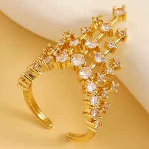 Macro view of castle-inspired gold ring with sparkling clear cubic zirconia stones