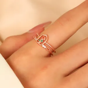 Elegant rose gold double band castle ring with colorful stones worn on woman's finger