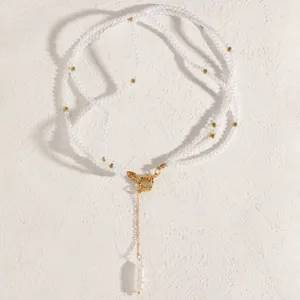 Detail showing white pearl strand with gold OT clasp and unique baroque pearl pendant.