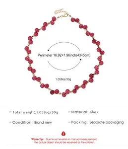 Detail showing red glass beaded necklace with gold spacers and length specifications