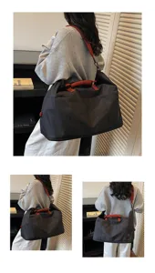 Detailed view of the large capacity travel duffel bag showcasing comfortable straps and style.