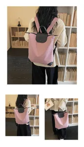 Zaino da commutatore leggero in rosa con patta in pelle nera, elegante zaino casual giornaliero.