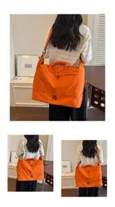 Large capacity orange travel duffel bag for women fitness and short trips gym storage.