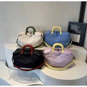 Large capacity travel duffel bag for women and men, gym and weekend overnight bag with shoulder strap.
