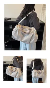 Detailed view of large capacity travel duffel bag with grid pattern, ideal for gym and trips.