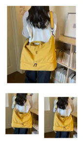 Large capacity travel duffel bag detail view, multi-compartment fitness gym bag in yellow.