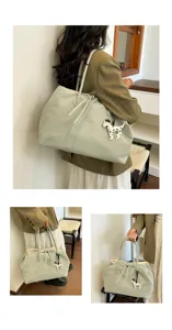 Large capacity canvas tote bag for women, commuter shoulder bag with cute puppy pendant, stylish.