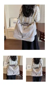 Large capacity travel duffel bag detail showing multi-functional wear and bottom compartment design.