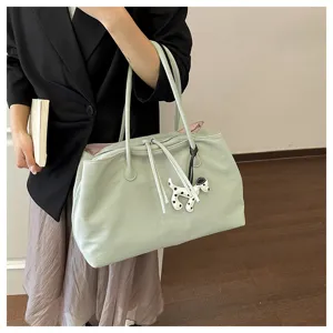 Light green tote bag with cute puppy charm, large capacity commuter shoulder bag for daily use.