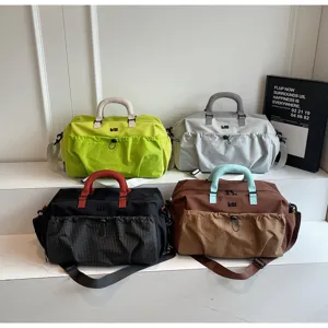 Large capacity travel duffel bag for women and men, stylish gym sports fitness bag.
