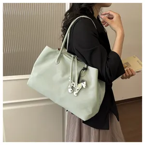 Stylish sage green tote bag with unique dog charm, large capacity shoulder commuting bag.