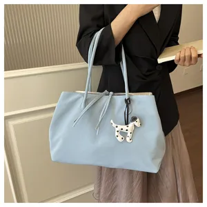 Chic light blue commuter tote bag with cute puppy charm, large capacity shoulder bag for women.