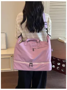 Detail view of the large capacity purple travel duffel bag with bottom shoe compartment.