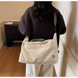 Beige large capacity travel shoulder bag with green straps and handles for women