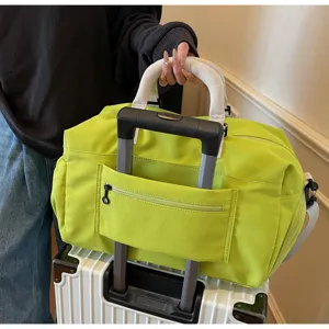 Large capacity travel duffel bag with luggage sleeve, perfect for short trips and gym sports use.