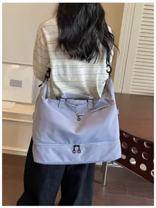 Large capacity travel duffel bag for women and men, gym bag with shoe compartment.