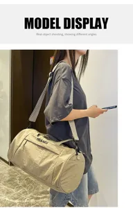 Model display of the casual khaki cylinder sports travel duffel bag showing daily usage.
