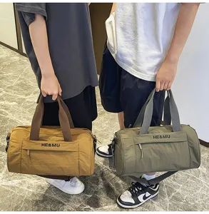 Large capacity sports duffel bag detail showing durable fabric and sturdy handles for travel.